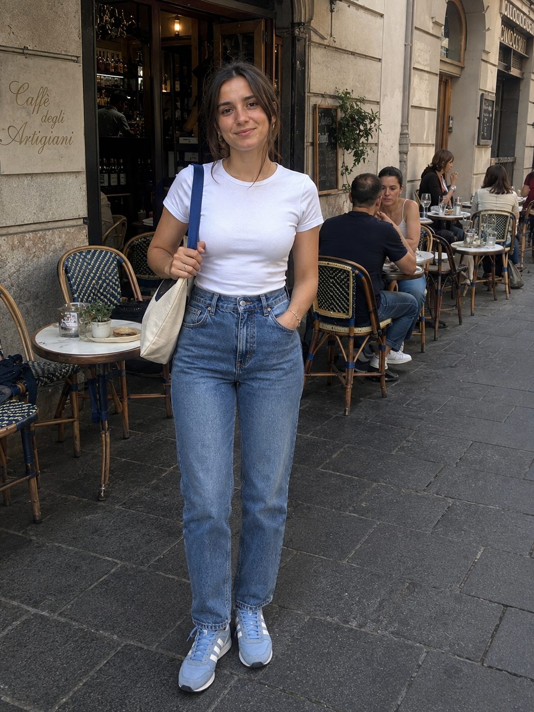 High-waisted straight jeans with a tucked tee