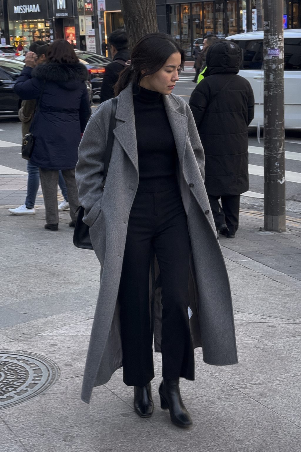 Long coat over a slim base