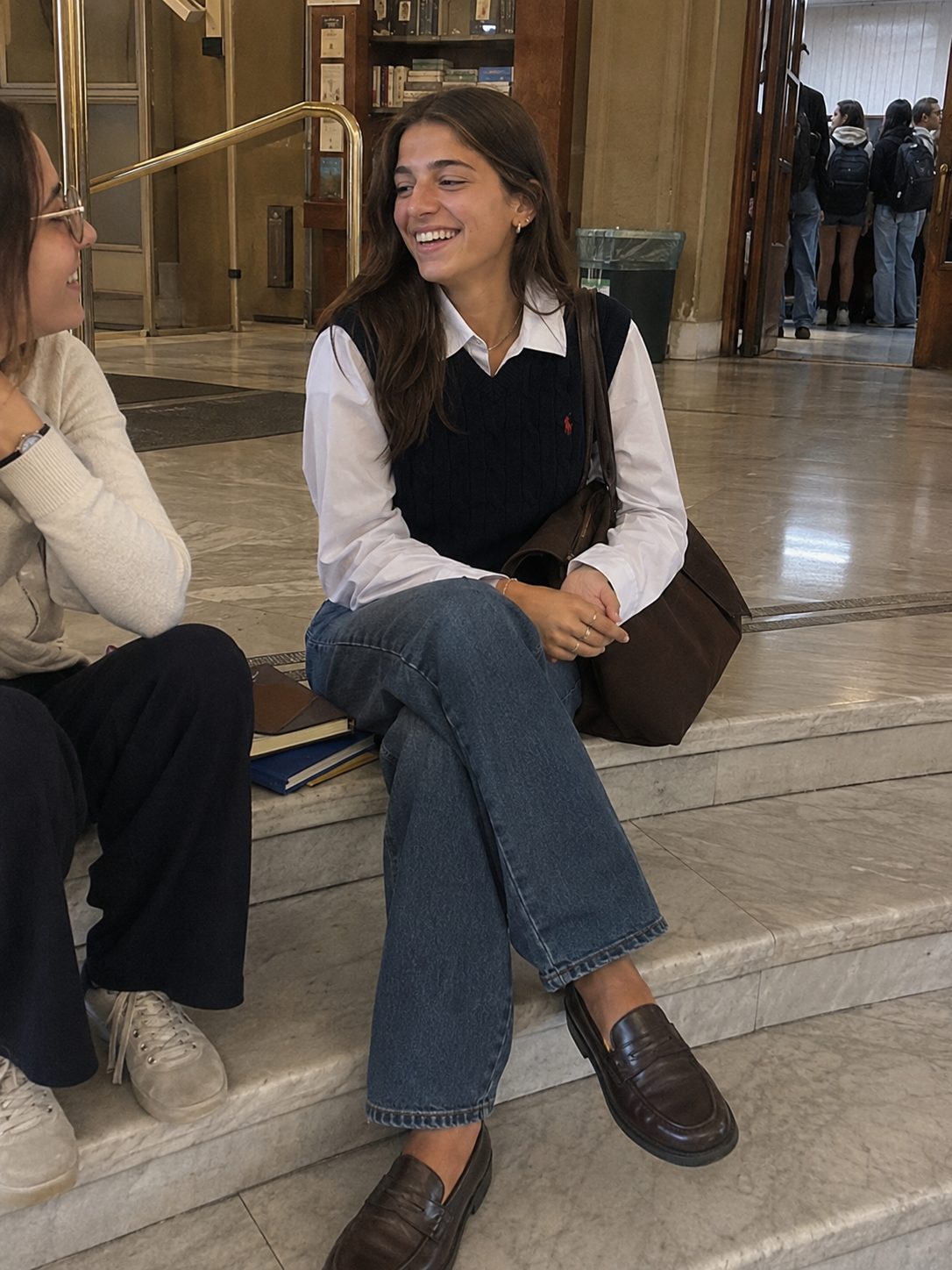 Sweater vest over a collared shirt