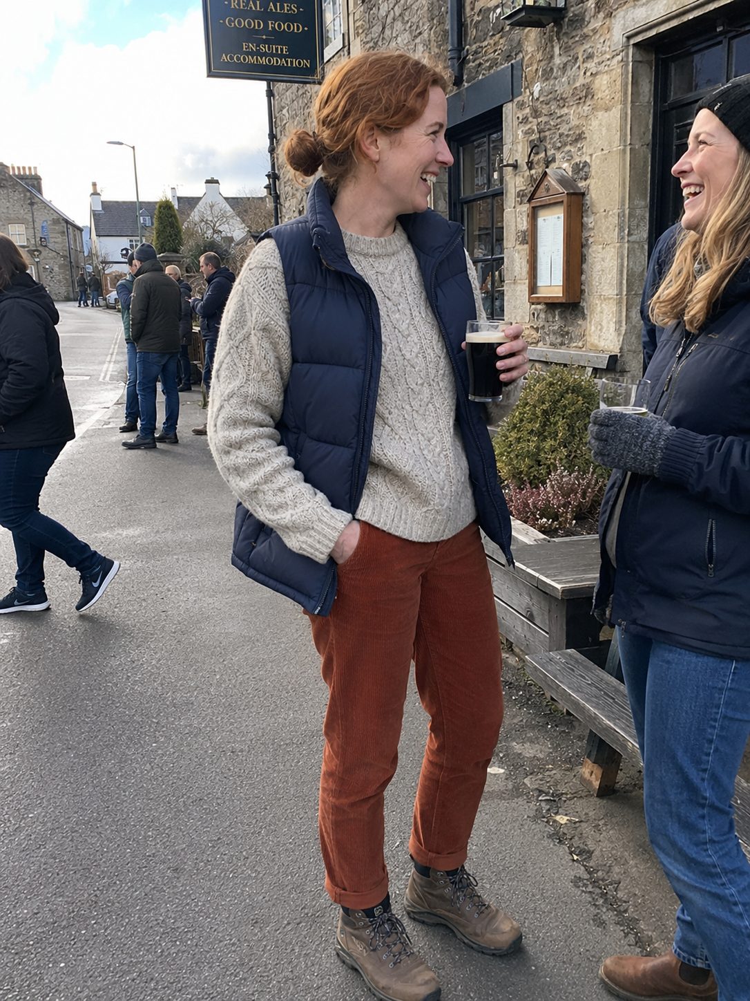 Puffer Vest Over a Chunky Cable Knit