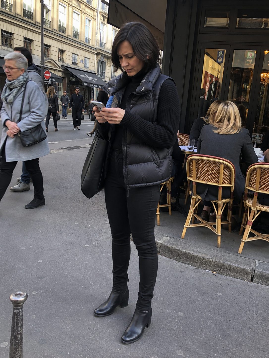 All-Black Outfit With a Black Puffer Vest