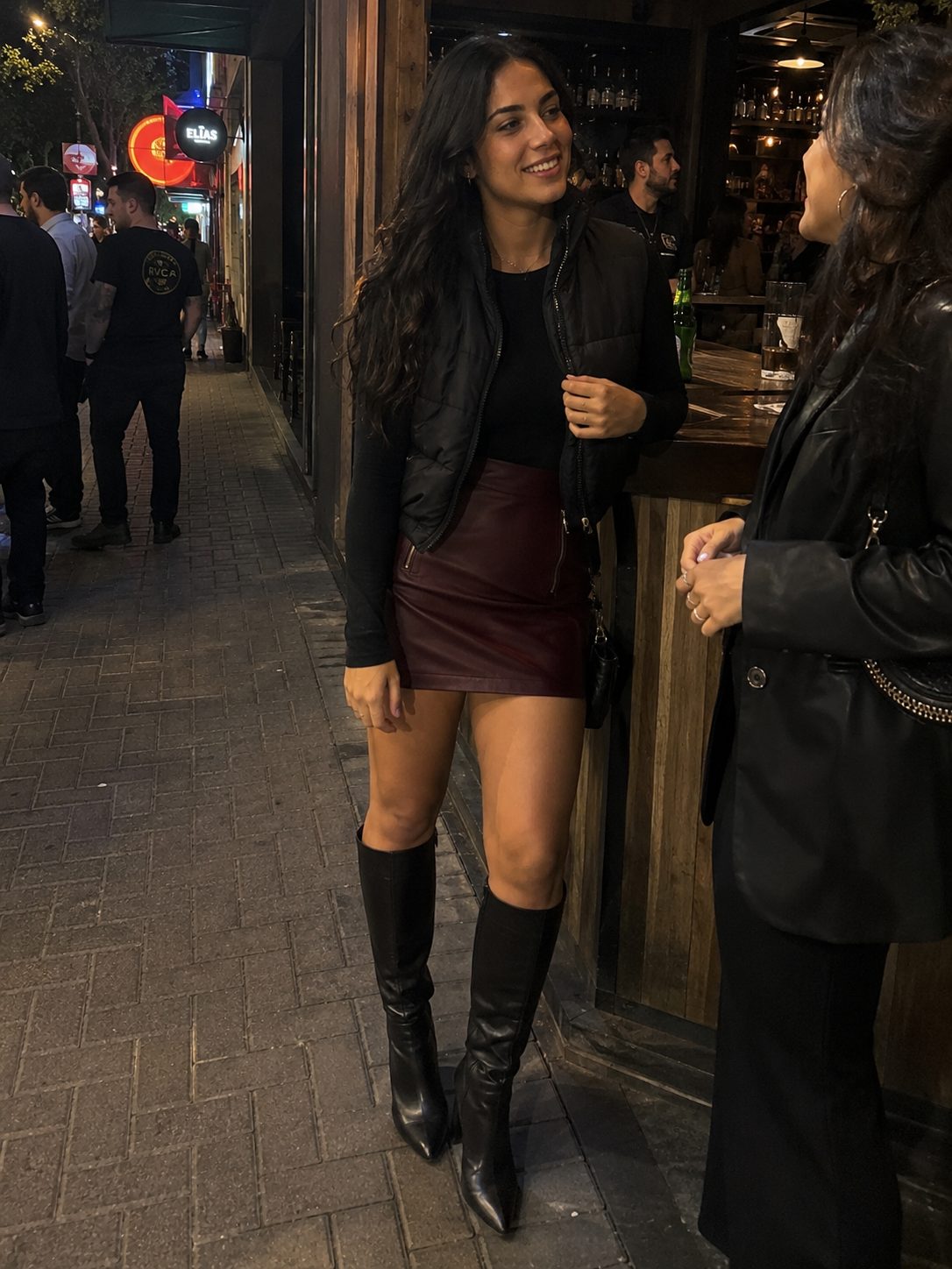 Cropped Puffer Vest With a Mini Skirt and Knee Boots