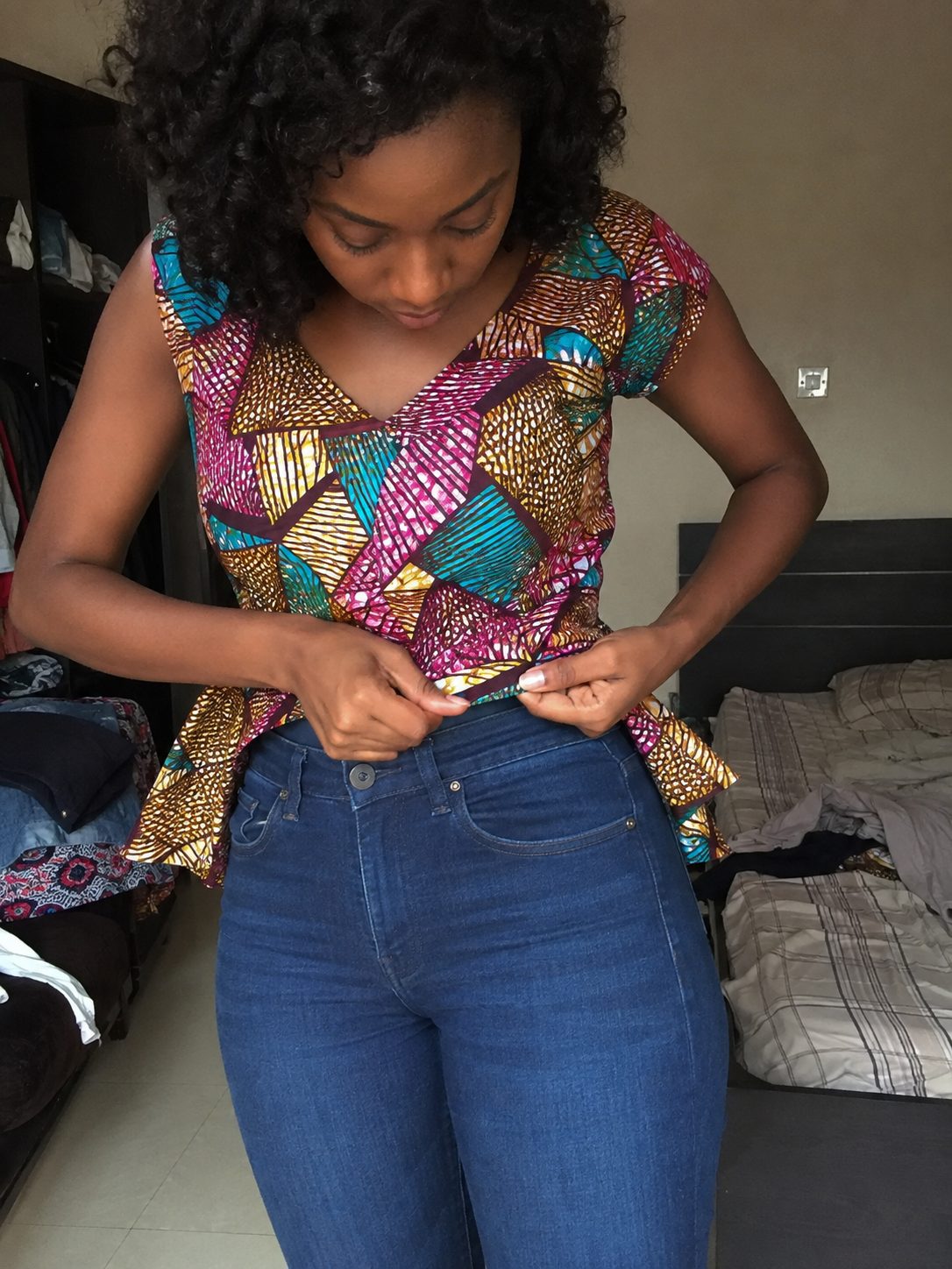 Tuck Only the Front of a Peplum Top into High-Waisted Jeans