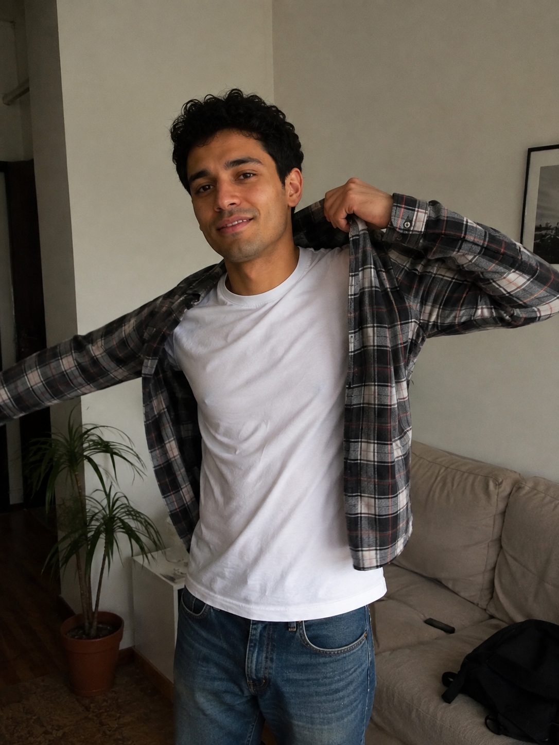 Layering thin base tee, mid overshirt, and outer jacket for a skinny frame
