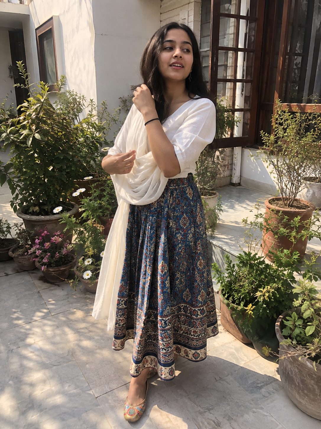 White Blouse and Blue Kalamkari Skirt with Colorful Punjabi Khussas