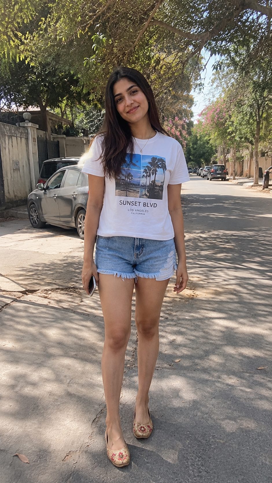 Frayed Denim Shorts with a Graphic Tee and Embroidered Khussas