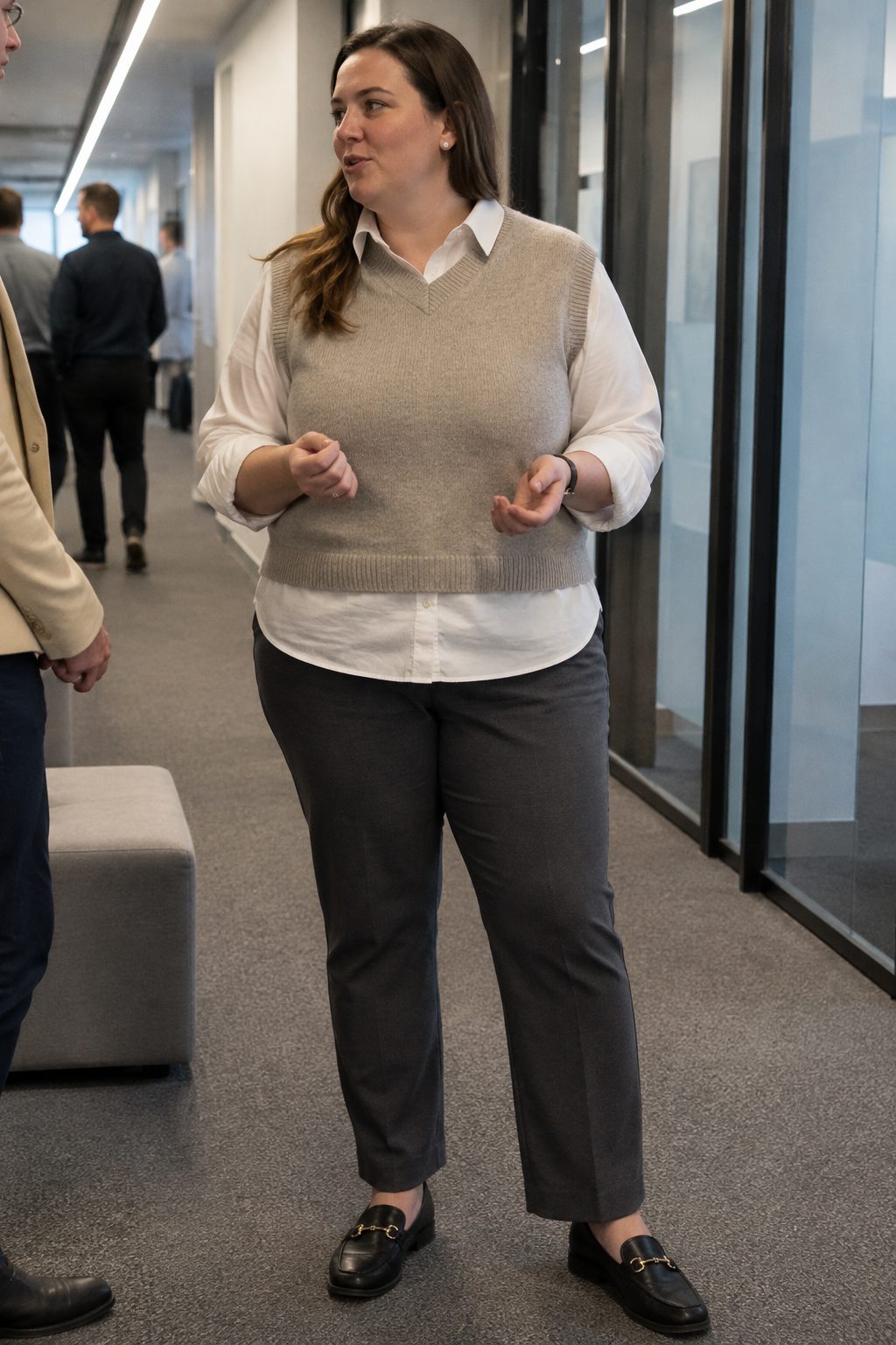 Knit vest over a poplin shirt