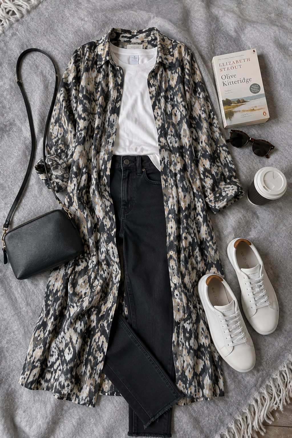 Shirt dress worn open over slim jeans flat lay